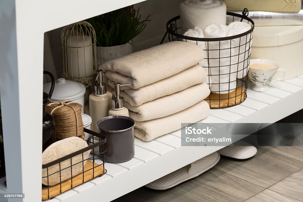 folded cotton towel under white marble bathroom marble counter Domestic Bathroom Stock Photo