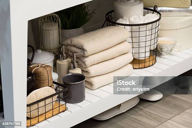 Folded Cotton Towel Under White Marble Bathroom Marble Counter Stock Photo - Download Image Now