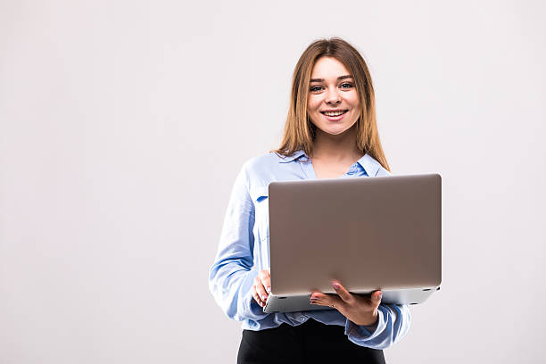 istock Girl with laptop in white background 628748932