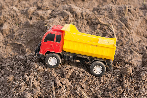 istock toy dump truck on the ground. 628750516