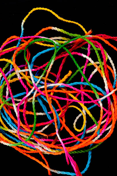 istock Mixed pile of colorful yarn on black background 628750986