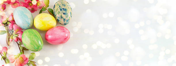 istock Painted Easter eggs and Japanese rose flowers 628760684