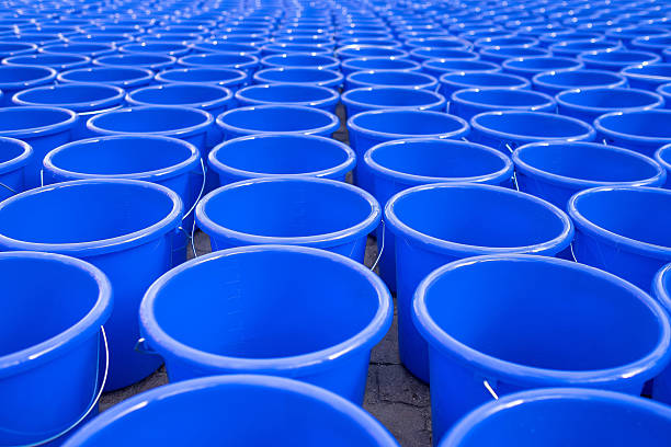 istock Hundreds of empty blue water bucket 628761854