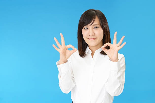 istock Business woman with ok hand sign 628763362