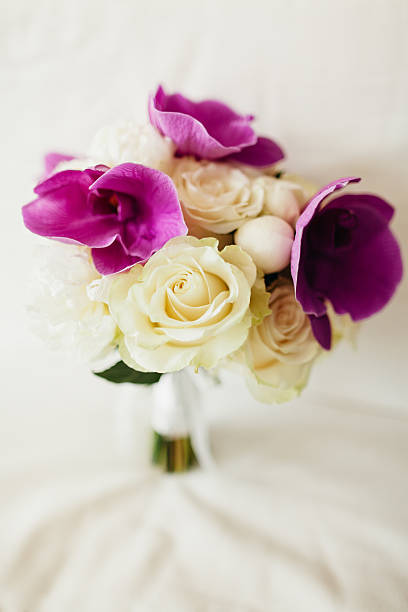 istock wedding bouquet orchids and peonies 628765190