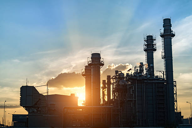 istock Oil refinery plant at sunrise with sky background 628766068
