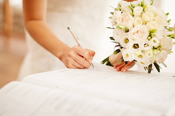 istock newlyweds holding wedding bouquet 628766312