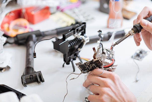 istock Detailed close up of mans hands working with drone chips 628790882