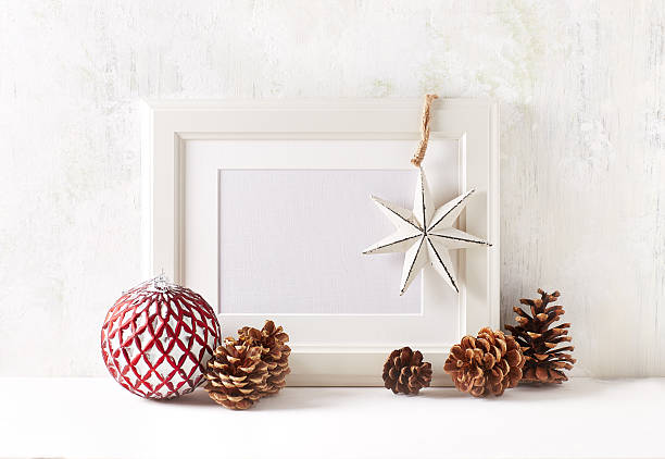 istock White picture frame with vintage Christmas decorations 628791126