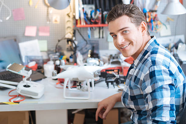 istock Portrain of handsome man working with drone 628792132