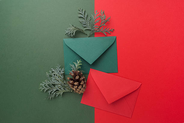 istock Red and green envelopes on christmas holiday background. Flat lay. 628792294