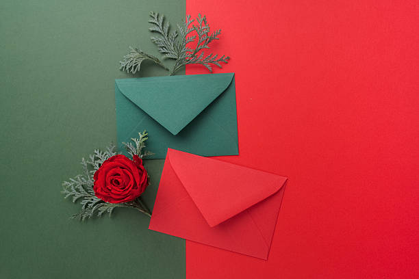 istock Red and green envelopes on christmas holiday background. Flat lay. 628792650