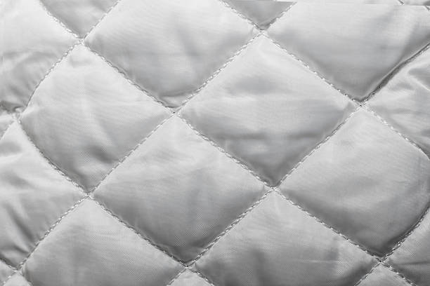 istock quilted fabric texture of white color for hammering, 628798728