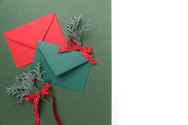 istock Red and green envelopes on christmas holiday background. Flat lay. 628798926