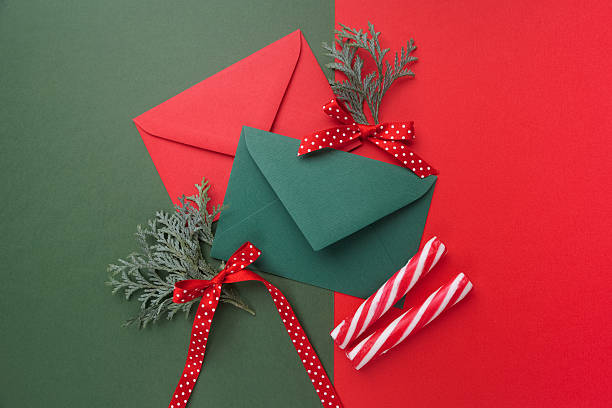 istock Red and green envelopes on christmas holiday background. Flat lay. 628799118