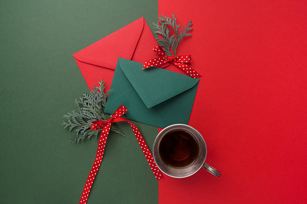 istock Red and green envelopes on christmas holiday background. Flat lay. 628799250
