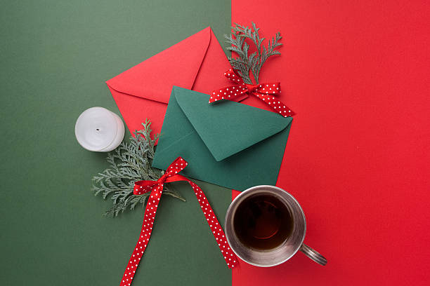 istock Red and green envelopes on christmas holiday background. Flat lay. 628799520