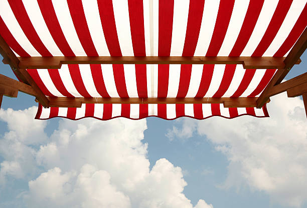 istock View from shade below red white striped awning 628801084