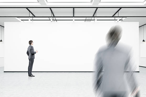 istock man with coffee waiting for his colleague 628801494