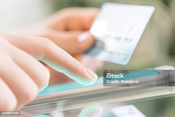 Woman Is Shopping Online Using A Smartphone Stock Photo - Download Image Now - Mobile Payment, Protection, Credit Card