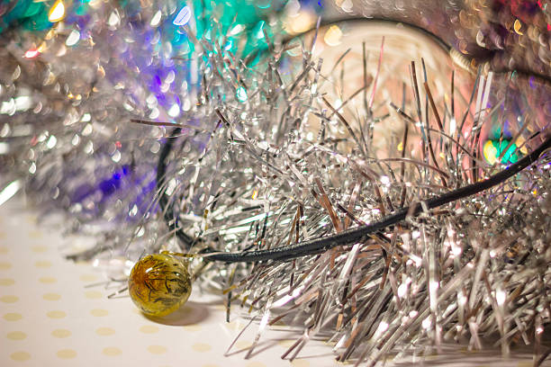 pendant with dandelion Pendant with small dried dandelion flower inside crystal made of epoxy resin close-up with tinsel ball of twigs and bokeh on the background shallow depth of field hardener stock pictures, royalty-free photos & images