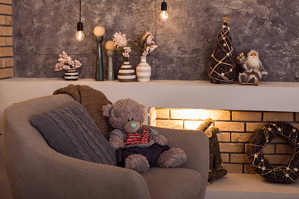 istock Teddy bear sitting at the gray chair 628803704