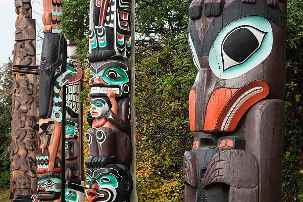 Photo of Colorful First Nations Totem Poles, Vancouver, BC, Canada