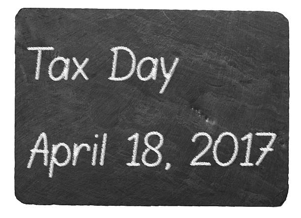 istock Tax Day concept using chalk on slate blackboard 628812522