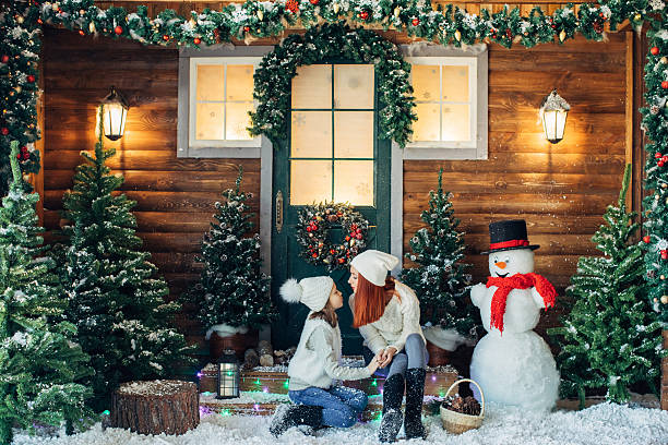 istock Mom and her daughter playing with snow 628812932