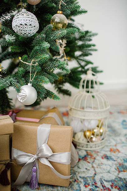 istock Beautiful christmas tree decorated with white and gold toy balls 628814372