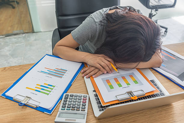 istock Woman feel tired, frustrated and sleeping on laptop and document 628815976