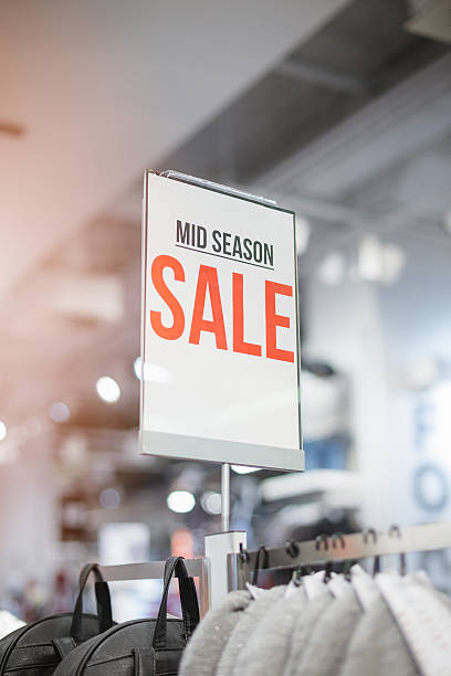 mid season SALE - billboard in shop window sign of mid season sale in shop mall closing down sale stock pictures, royalty-free photos & images