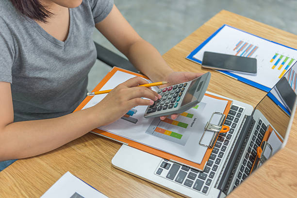 istock Close-up of accountant hand using calculator while holding pencil 628817182