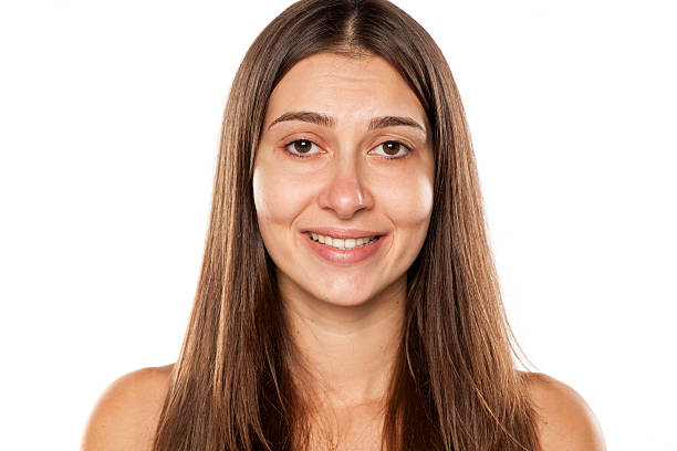 istock Beautiful young woman without makeup and false smile 628817420