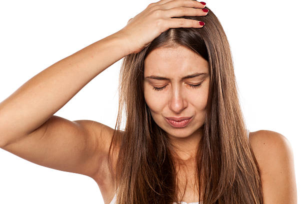 istock young woman have a headache 628818442