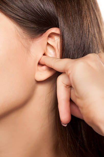 istock little finger in her ear 628818526