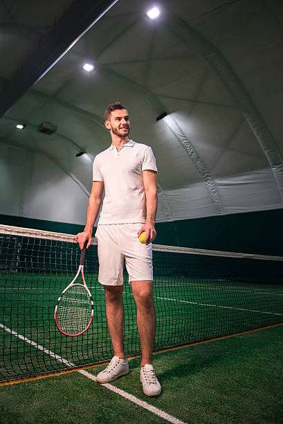 istock Delighted handsome tennis player going to play 628818744