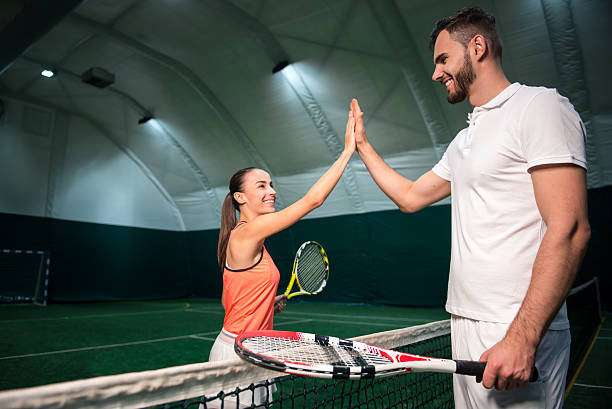 istock Joyful professional players going to play tennis 628819332