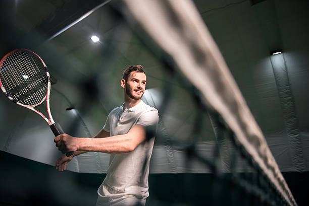 istock Positive man playing tennis 628820122