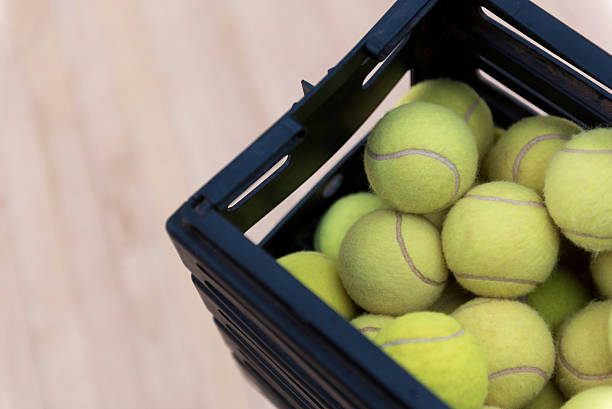 istock Tennis balls lying in the box 628821038