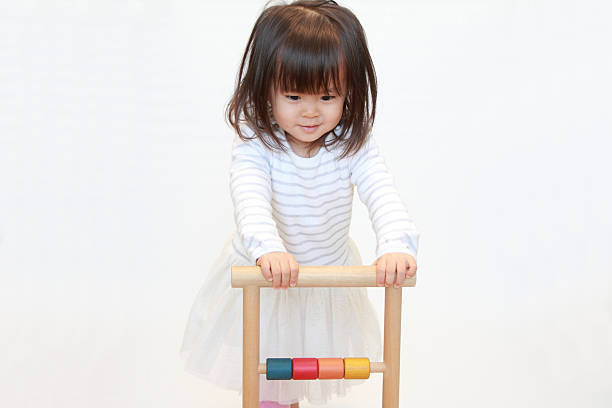 istock Japanese girl pushing a cart (2 years old) 628821330
