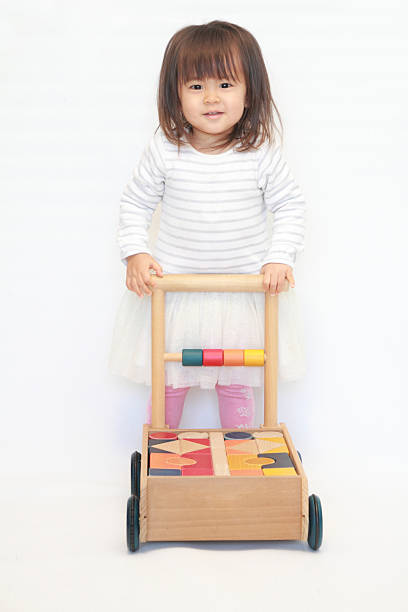 istock Japanese girl pushing a cart (2 years old) 628821388