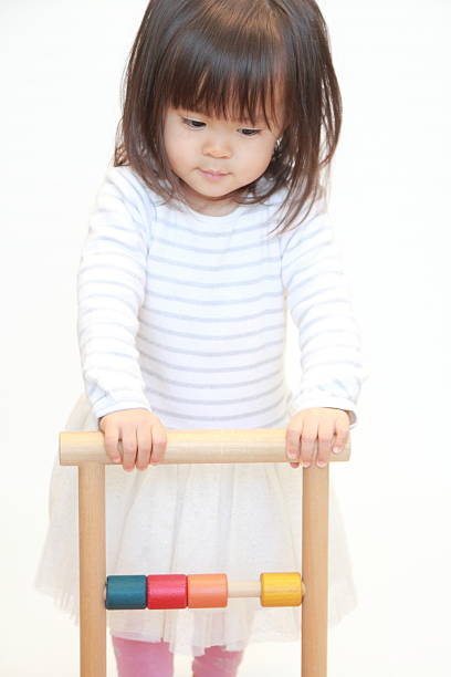 istock Japanese girl pushing a cart (2 years old) 628821412