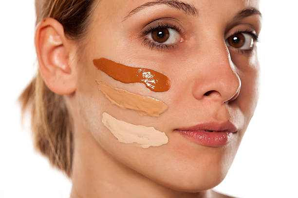 istock young beautiful woman with three different foundation on her face 628835448