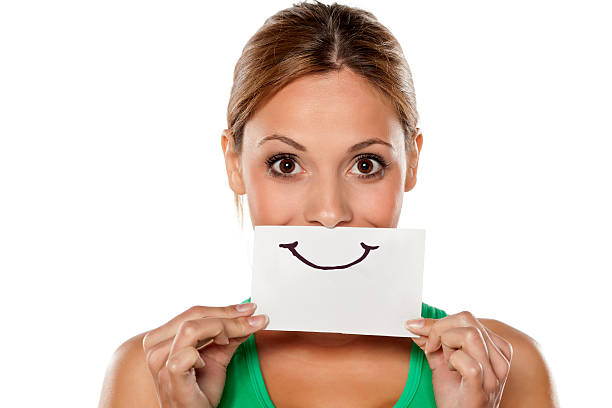 happy young woman with emotions drawn on a piece of