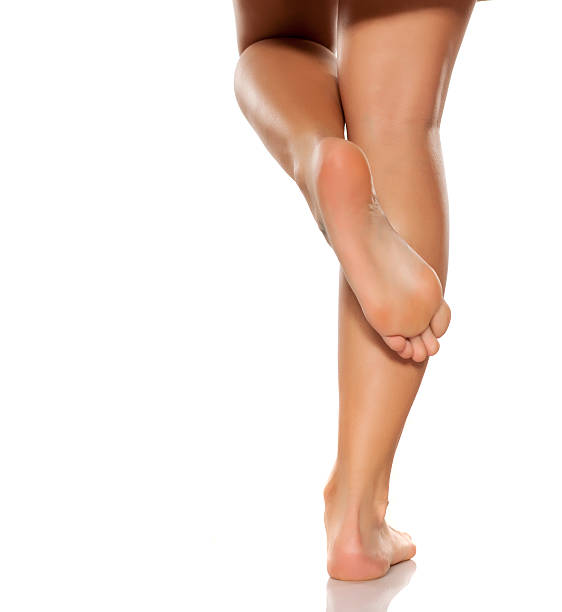 istock beautifully cared women's legs and feet on white background 628835636