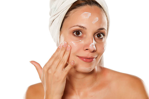 istock young beautiful woman with a towel on her head, applied 628835698