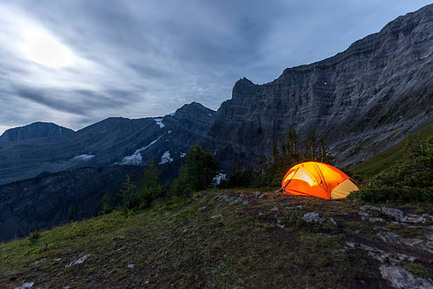 istock Illuminated tent camping on ridgeline of mountain 628836330