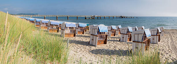 sandy beach and traditional wooden beach chairs on island rugen - binz imagens e fotografias de stock