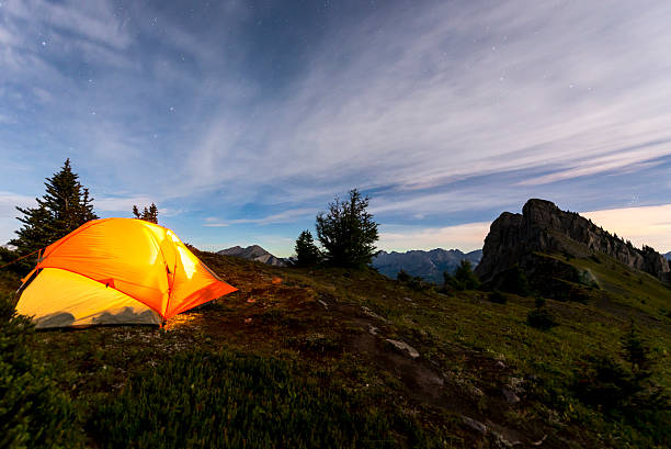 istock Illuminated tent camping on ridgeline of mountain 628836628